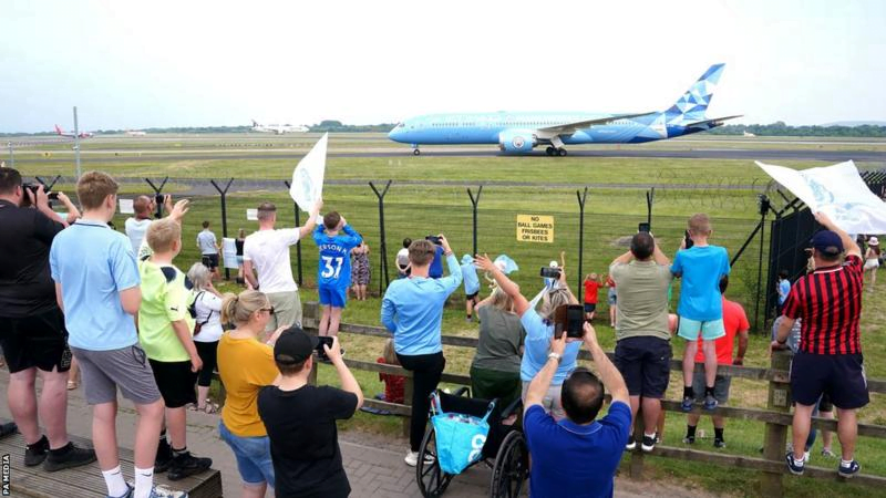 Fans welcome Man City home after Champions League win