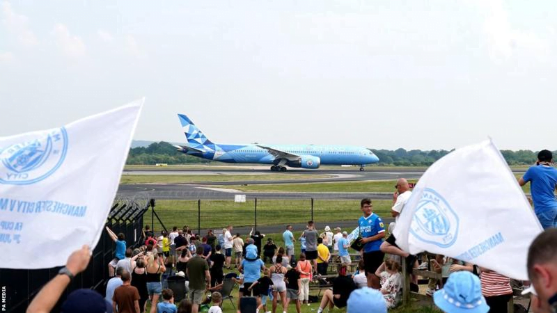 Fans welcome Man City home after Champions League win